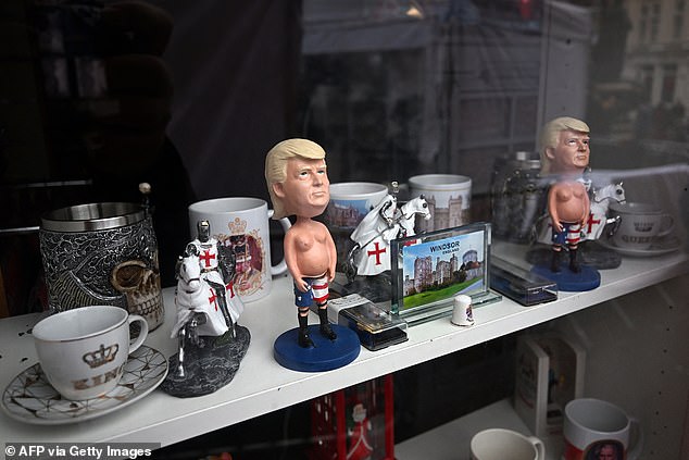 A figurine of Donald Trump is displayed for sale in the window of a shop in Windsor today