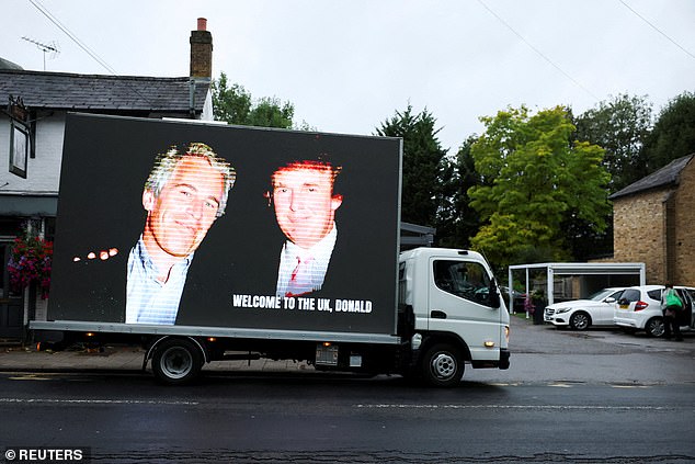 An image of Donald Trump alongside Jeffrey Epstein is displayed on a vehicle in Windsor today