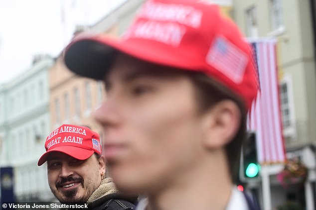 A supporter of US President Donald Trump stands outside Windsor Castle this morning