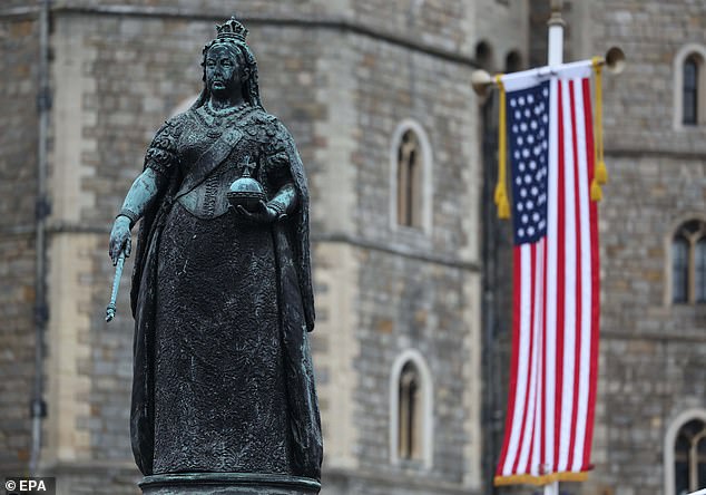 The Queen Victoria Statue next to the flag of the United States of America in Windsor today