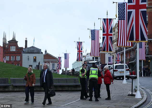 Police officers patrol in Windsor this morning as the state visit gets underway
