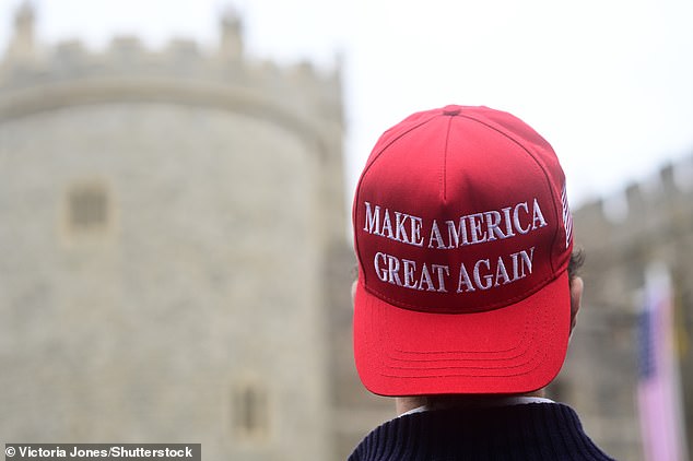 A supporter of US President Donald Trump stands outside Windsor Castle this morning