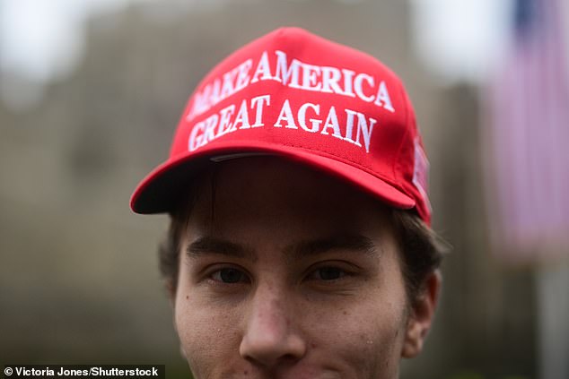 A supporter of US President Donald Trump stands outside Windsor Castle this morning