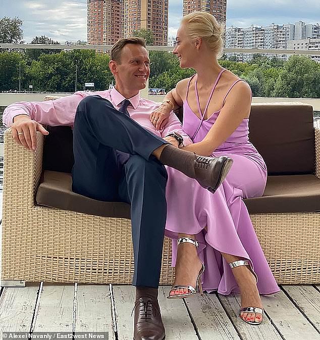 Navalny, pictured with his wife Yulia in happier times, crusaded against official corruption and staged massive anti-Kremlin protests - drawing the ire of the Kremlin