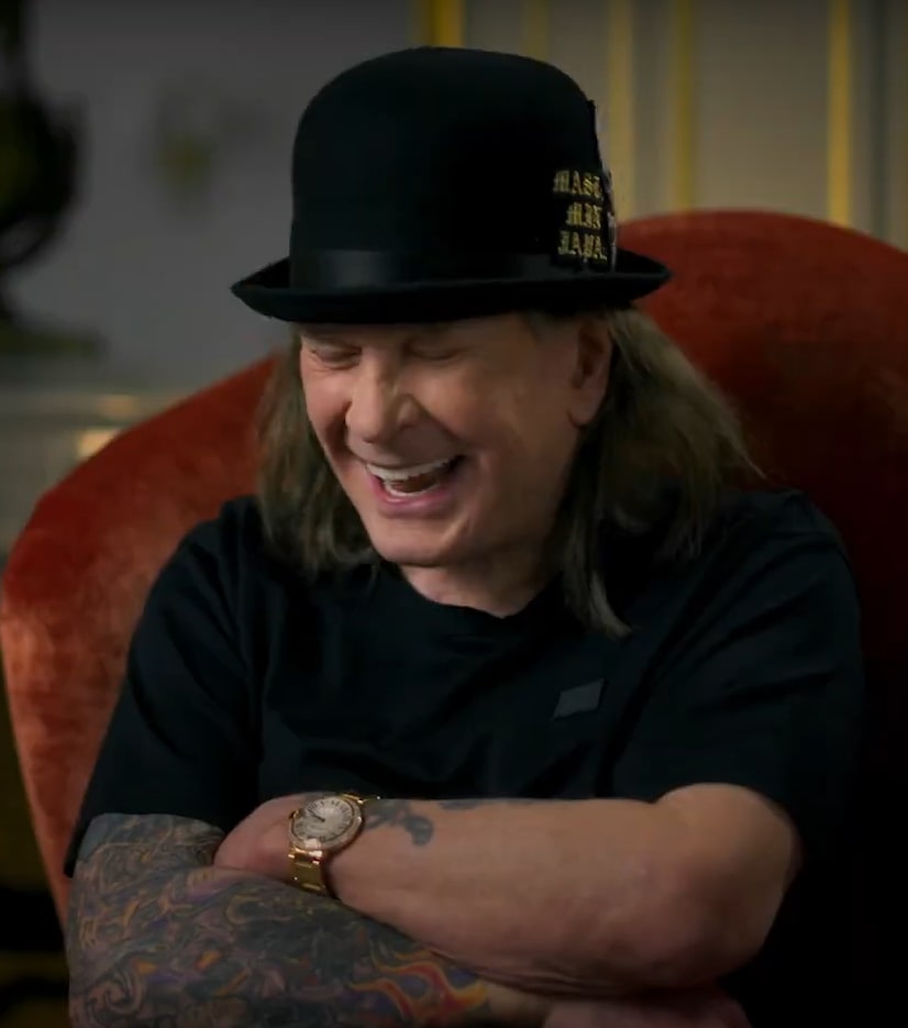 Ozzy Osbourne laughing.