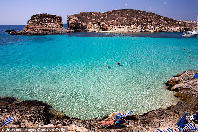 Malta's Blue Lagoon offers crystal-clear turquoise waters perfect for swimming or snorkelling