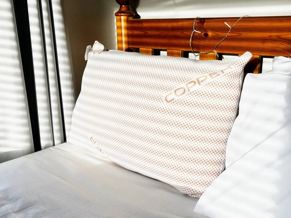 Copper-infused pillow on a bed.