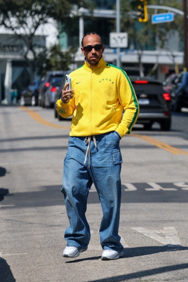 BGUK_3354927 - *EXCLUSIVE* Los Angeles, CA WEB MUST CALL FOR PRICING - Rocking in his Nike Brazilian Football Jacket, the Former F1 champ Lewis Hamilton was spotted out and about in Los Angeles, cruising through the city in his ultra-rare Virgil Abloh-designed Mercedes-Benz  but it wasnt just the car catching eyes. The racing icon who currently stands 6th in the F1 championship with his new team Ferrari was seen running errands and deep in conversation with model Ashley Moore. Pictured: Lewis Hamilton BACKGRID UK 15 SEPTEMBER 2025 BYLINE MUST READ: The Daily Stardust / BACKGRID UK: +44 208 344 2007 / uksales@backgrid.com USA: +1 310 798 9111 / usasales@backgrid.com *Pictures Containing Children Please Pixelate Face Prior To Publication*