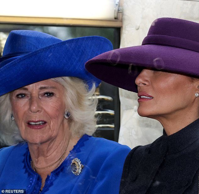 Britain's Queen Camilla and US first lady Melania Trump sit in a carriage during a procession through Windsor Castle. Melania looked effortlessly chic in a Christian Dior Haute Couture dark gray skirt suit that flared out at the waist and fell just below her knees
