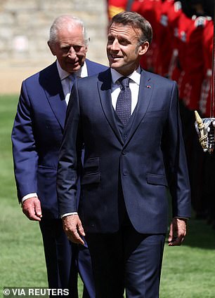 Mr Macron is seen walking ahead of King Charles during his state visit to the UK in July of this year