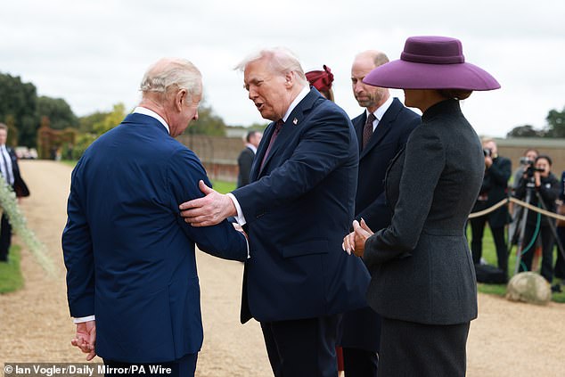 And the president also appeared to greet the King warmly, holding the monarch's upper arm as the pair meet in front of the world's media