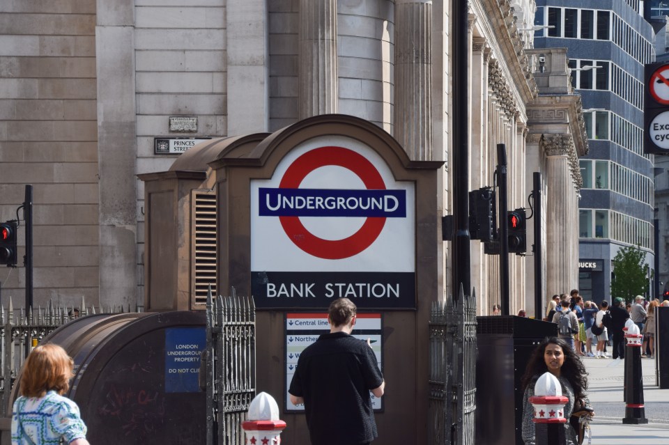 People walking outside Bank London Underground Station.