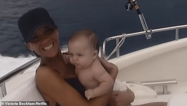 Victoria appeared to extend an olive branch to her son Brooklyn with the inclusion of a blink and you'll miss it flashback snap of him as a baby included in the first trailer