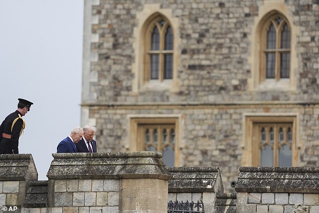 President Trump is seen being accompanied by King Charles as they arrive for a Beating Retreat musical performance on the East Lawn