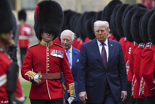 King Charles III and US President Donald Trump review the guard of honour at Windsor Castle