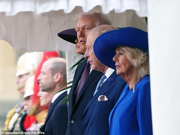 President Donald Trump salutes as he stands beside King Charles III and Queen Camilla with Melania Trump on the left as Kate and Prince William listen on the far left at Windsor Castle