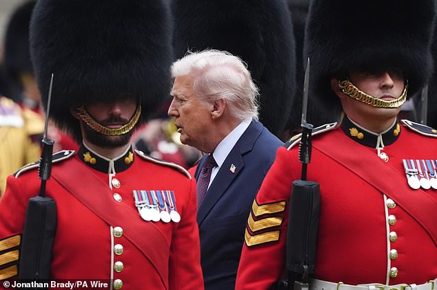 King Charles III and US President Donald Trump review the guard of honour at Windsor Castle