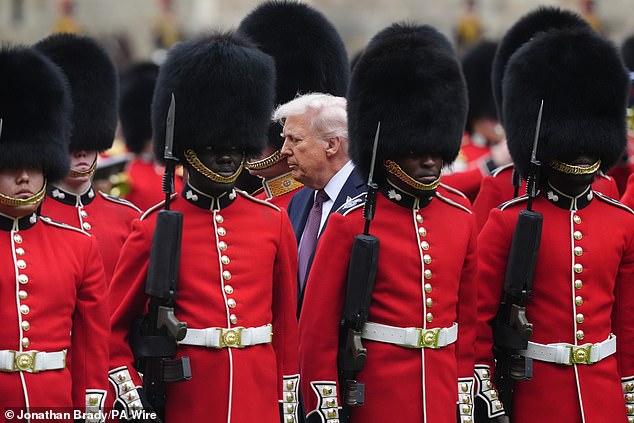 King Charles III and US President Donald Trump review the guard of honour at Windsor Castle