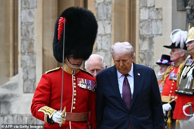 King Charles III and US President Donald Trump review the guard of honour at Windsor Castle