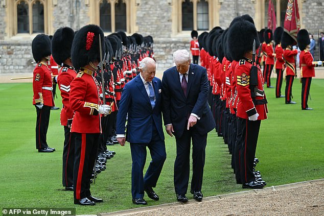 King Charles III and US President Donald Trump review the guard of honour at Windsor Castle