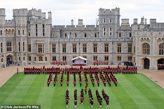 Members of the military form up in a guard of honour for the ceremonial welcome today