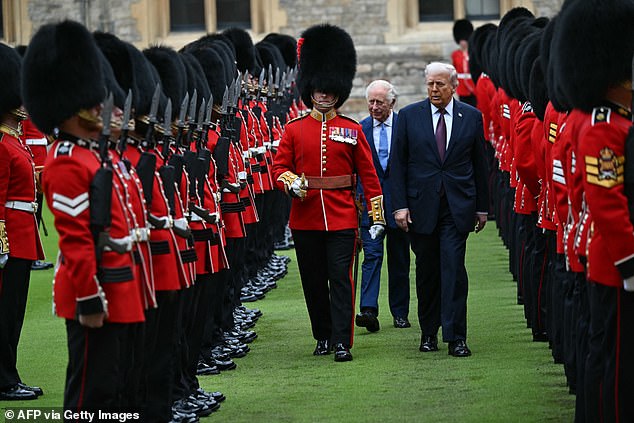 King Charles III and US President Donald Trump review the guard of honour at Windsor Castle