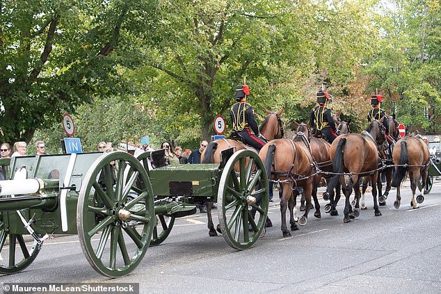 The King's Troop Royal Horse Artillery and their gun carriages ride through Windsor today