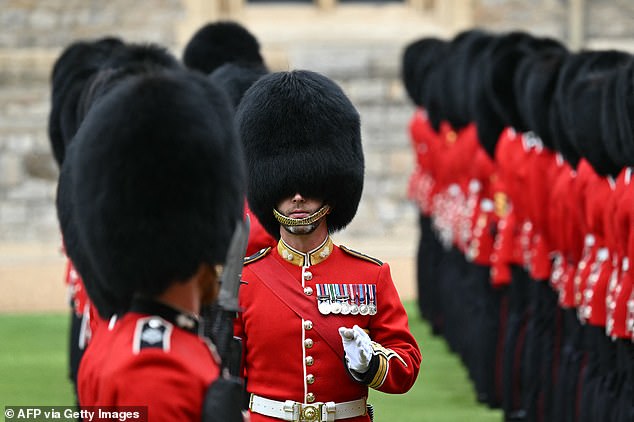 Guardsmen prepare for a ceremonial welcome in the Quadrangle at Windsor Castle today