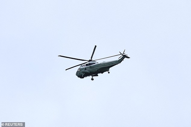 A helicopter carrying Donald and Melania Trump arrives at Windsor Castle this afternoon
