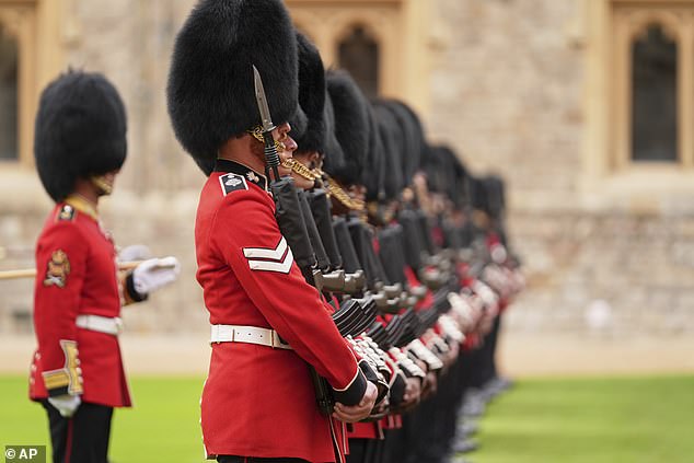 Guardsmen prepare for a ceremonial welcome in the Quadrangle at Windsor Castle today