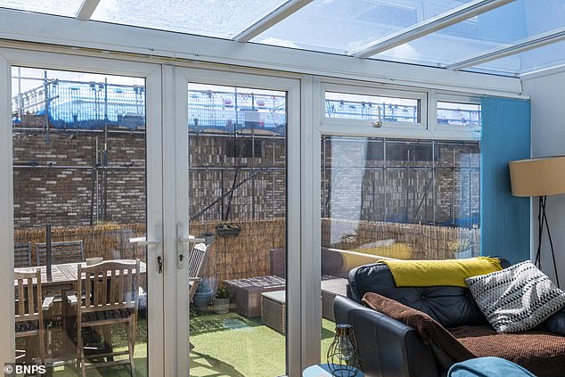 After: Mrs Bates' view from her first storey flat after construction of the wall