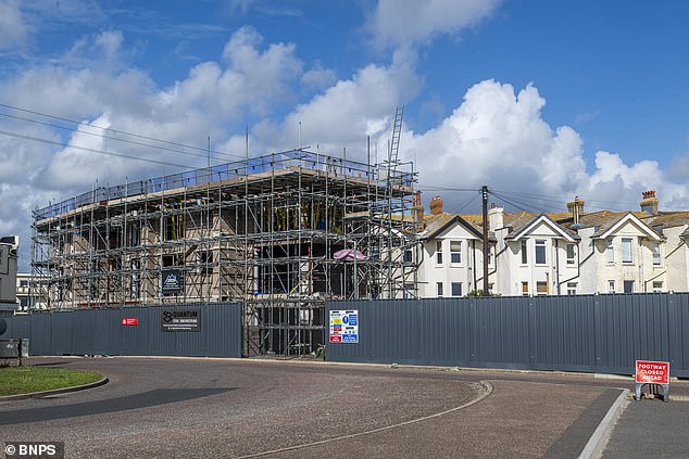 The development in construction in front of Mrs Bates's home. When completed it will feature 27 luxury flats