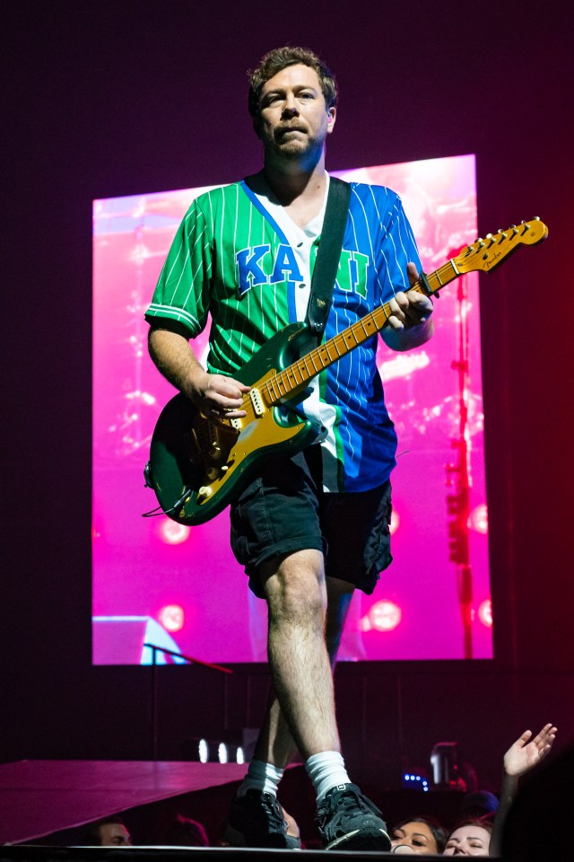 James Bourne of Busted performing with a guitar at The O2 Arena.