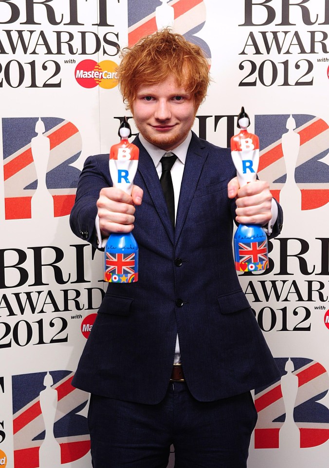 Ed Sheeran holding his British Breakthrough Act award and Best Male Solo Artist award at the 2012 Brit Awards.