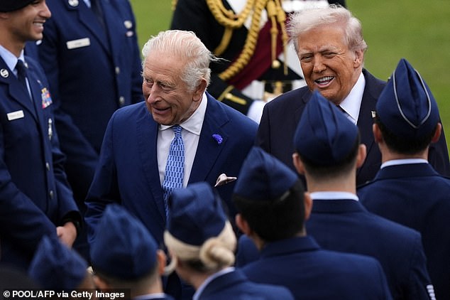 Charles and Mr Trump smile as they mingle with military personnel following the Beating Retreat ceremony