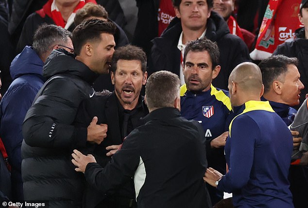 The Atletico Madrid manager had to be restrained by his own coaching team and stewards during the touchline clash