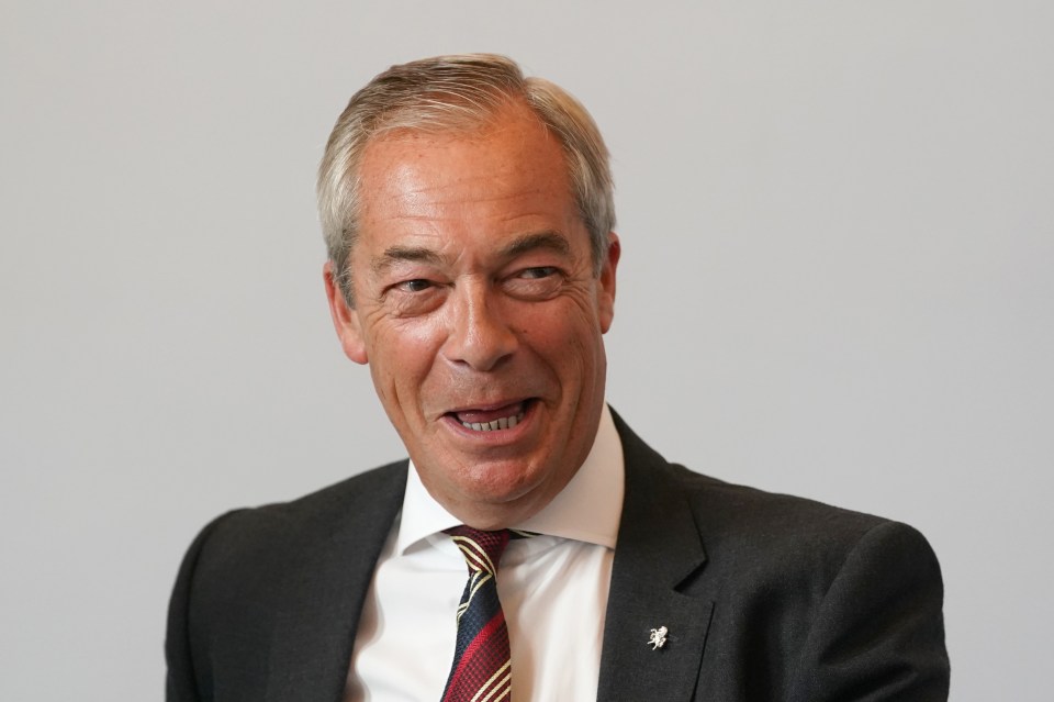 Reform UK leader Nigel Farage attending a meeting.