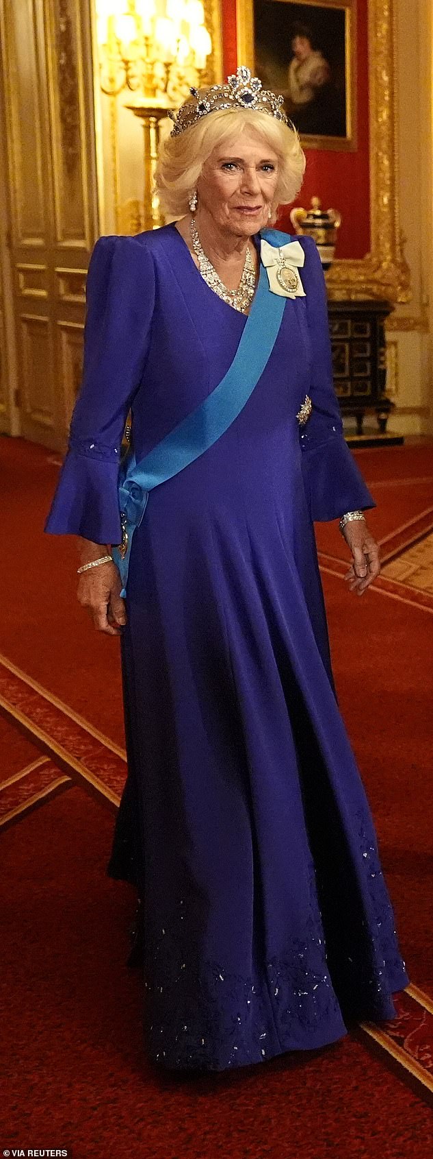 Camilla wore her elegant Bruce Oldfield gown and completed the look with a diamond-trimmed pendant, containing a photograph of the former monarch