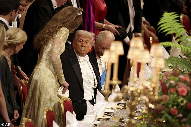 President Donald Trump (center) greets Princess Kate (left) as she arrives for the state banquet at Windsor Castle Wednesday night