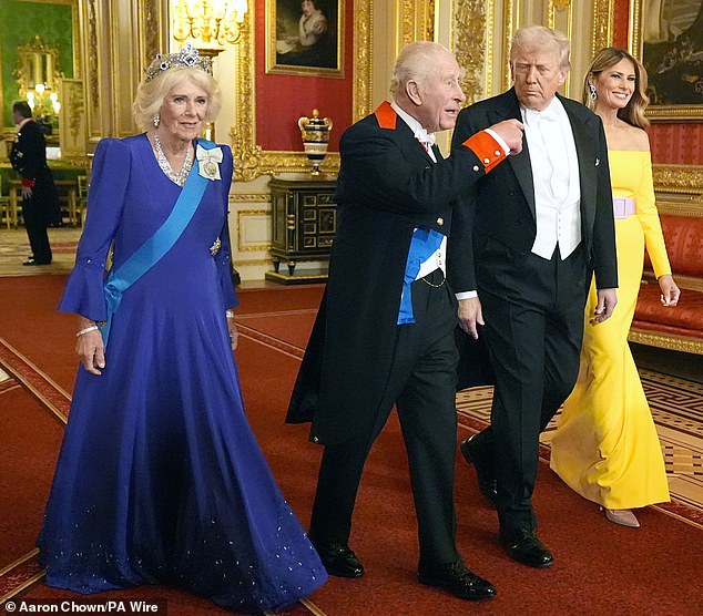 Queen Camilla exuded elegance in a royal blue silk marocain embroidered dress