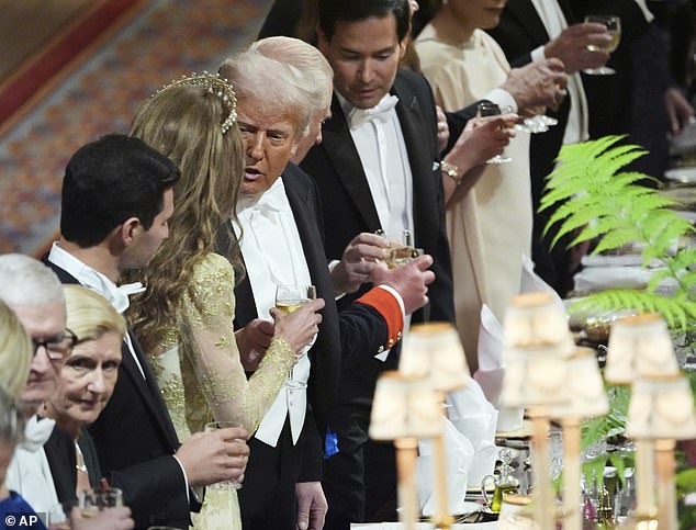 President Donald Trump, center, and Britain's Kate, Princess of Wales, center left, attend a State Banquet at Windsor Castle in Windsor, England, Wednesday, Sept. 17, 2025. (AP Photo/Evan Vucci, Pool)