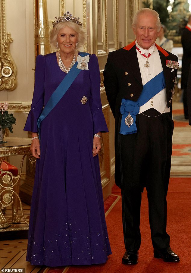 Britain's Queen Camilla and King Charles pose for a photo at the State Banquet during U.S. President Donald Trump's state visit, at Windsor Castle, in Windsor, Britain, September 17, 2025. REUTERS/Phil Noble/Pool