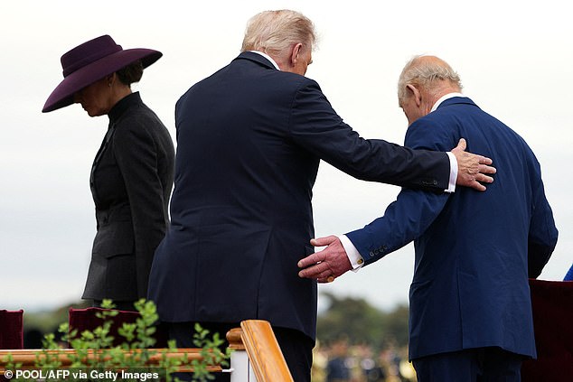 US First Lady Melania Trump (L), US President Donald Trump (2L), Britain's King Charles III take their seats on the dias to watch the Beating Retreat military ceremony on the East Lawn at Windsor Castle, in Windsor, on September 17, 2025, during the US President's second State Visit. US President Donald Trump arrived in Britain for an unprecedented second State Visit, with the UK government rolling out a royal red carpet welcome to win over the mercurial leader. (Photo by Doug MILLS / POOL / AFP) (Photo by DOUG MILLS/POOL/AFP via Getty Images)