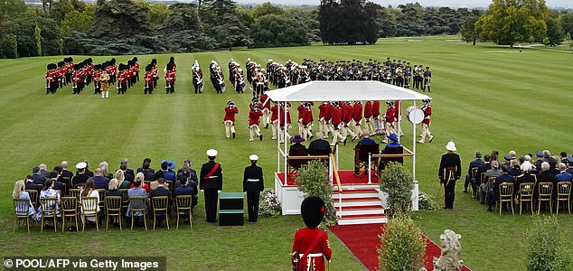 US First Lady Melania Trump, US President Donald Trump, Britain's King Charles III and Britain's Queen Camilla sit on the dias to watch the Beating Retreat military ceremony on the East Lawn at Windsor Castle, in Windsor, on September 17, 2025, during the US President's second State Visit. US President Donald Trump arrived in Britain for an unprecedented second State Visit, with the UK government rolling out a royal red carpet welcome to win over the mercurial leader. (Photo by Jordan Pettitt / POOL / AFP) (Photo by JORDAN PETTITT/POOL/AFP via Getty Images)
