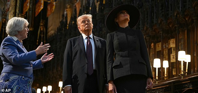 U.S. President Donald Trump, centre, and U.S. First Lady Melania Trump, right, tour the quire of St George's Chapel with Chapter Clerk Charlotte Manley, left, at Windsor Castle, in Windsor, England, Wednesday Sept. 17, 2025, during the US president's second State Visit to the UK. (Andrew Caballero-Reynolds/Pool Photo via AP)