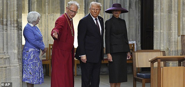 The Dean of Windsor, Rt. Rev. Christopher Cocksworth, second from left, gestures to President Donald Trump and first lady Melania Trump during their visit to St George's Chapel at Windsor Castle, in Windsor, England, Wednesday Sept. 17, 2025. (Aaron Chown/Pool Photo via AP)