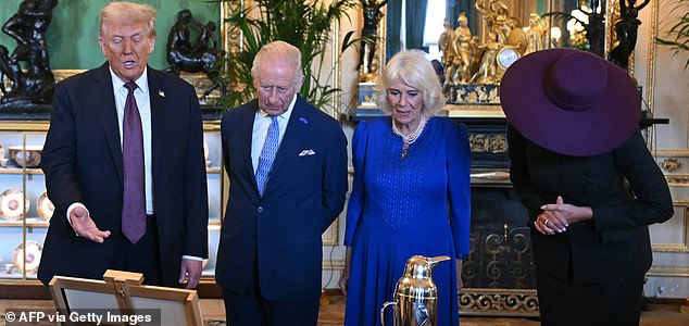 US President Donald Trump, Britain's King Charles III, Britain's Queen Camilla and US First Lady Melania Trump view items from the Royal Collection in the Green Drawing Room at Windsor Castle, in Windsor, on September 17, 2025, during the US President's second State Visit. US President Donald Trump arrived in Britain for an unprecedented second State Visit, with the UK government rolling out a royal red carpet welcome to win over the mercurial leader. (Photo by ANDREW CABALLERO-REYNOLDS / AFP) (Photo by ANDREW CABALLERO-REYNOLDS/AFP via Getty Images)