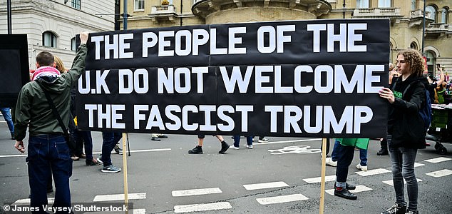 Mandatory Credit: Photo by James Veysey/Shutterstock (15488784c) Protesters hold up a 'The people of the UK do not welcome the facist Trump' banner in Portland place Anti-Trump protest, London, UK - 17 Sep 2025