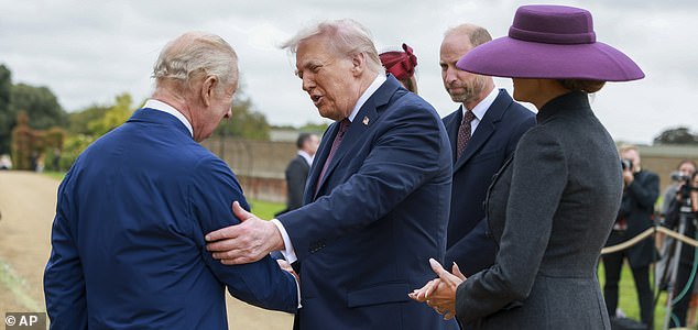 President Donald Trump and first lady Melania Trump are welcomed by Britain's King Charles III, in the Walled Garden on the Windsor Castle estate, in Windsor, England, Wednesday, Sept. 17, 2025. (Ian Vogle/Pool Photo via AP)