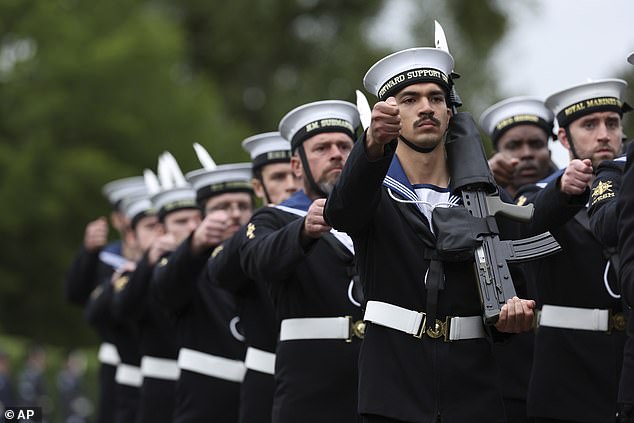Members of the British Navy march during a carriage procession towards Windsor Castle